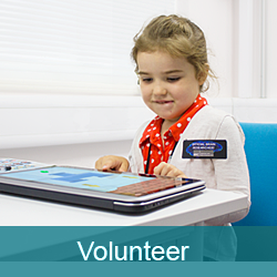 Child taking part in an experiment at the CBU using a touch screen device